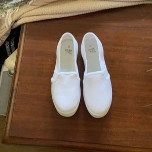 White canvas slip-ons